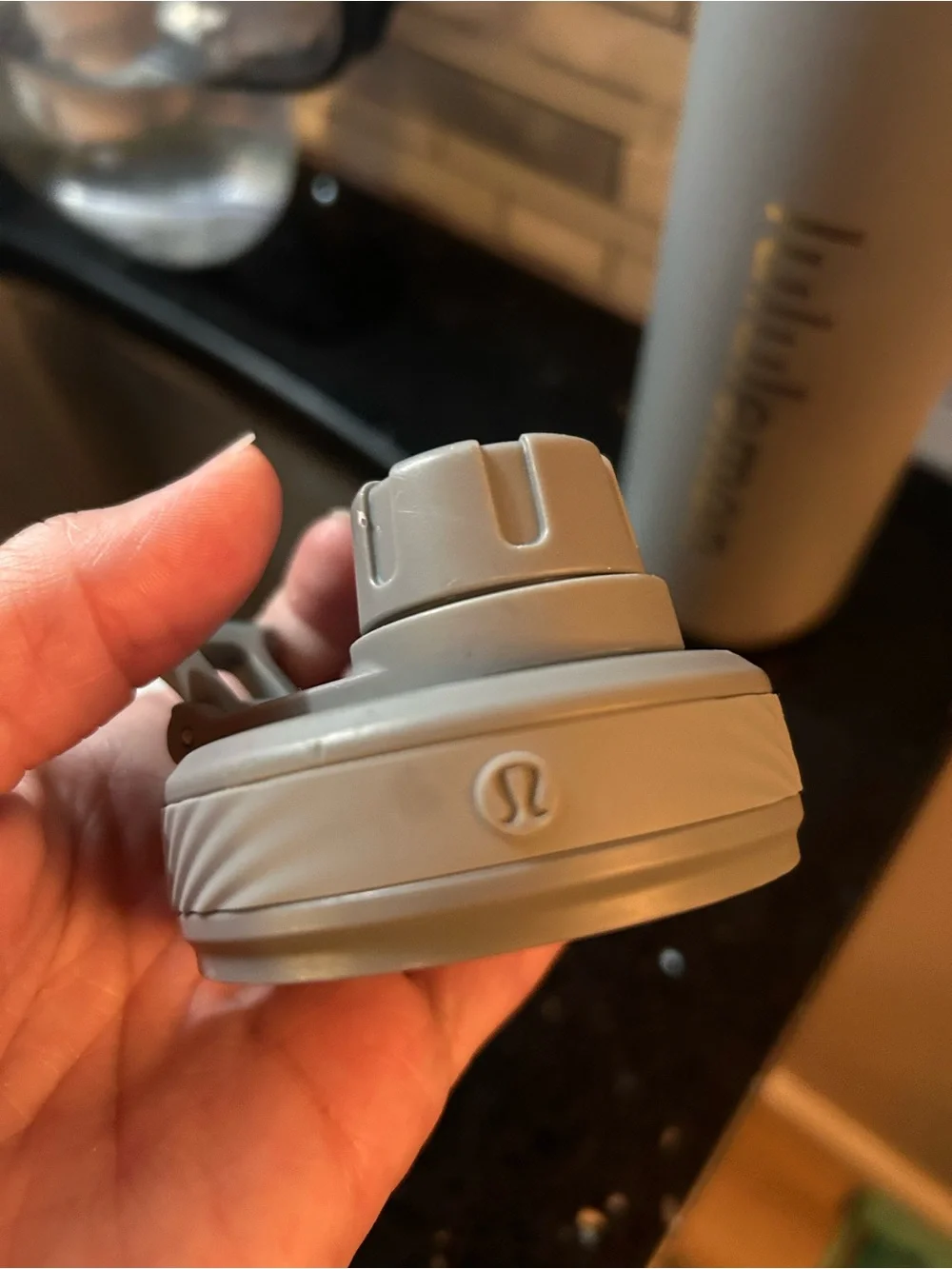 One gray lululemon water bottle metal screw on cap 120z